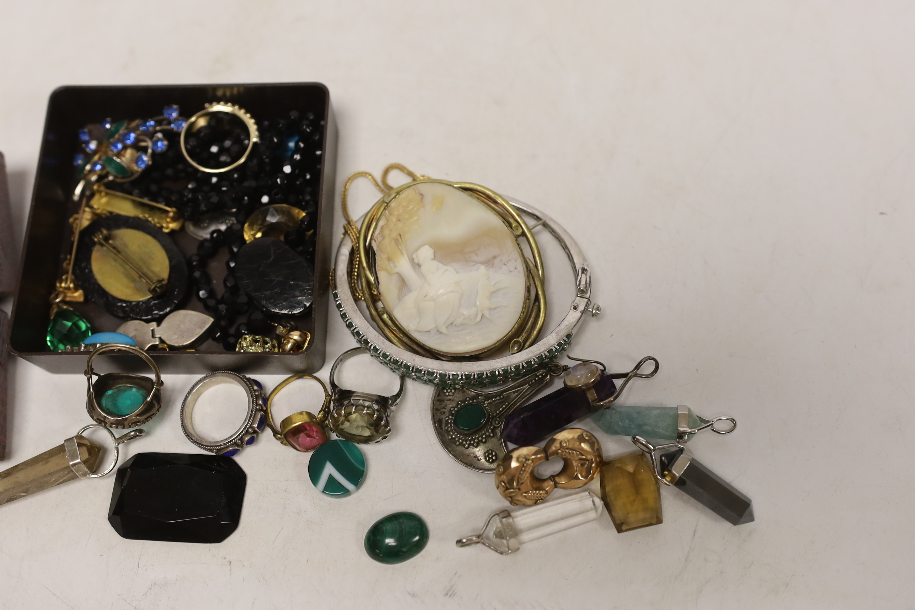 A small group of assorted costume jewellery including fob seal, pendants, rings, etc.